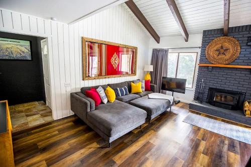 a living room with a couch and a fireplace at Mammoth's Best Location! 2BRLoft by Canyon Lodge in Mammoth Lakes