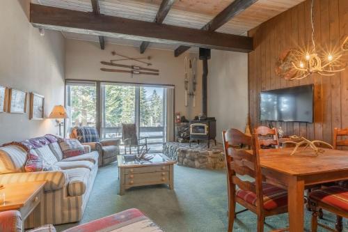 a living room with a couch and a table at Pet Friendly 2B2B on Lake Basins Bike Path! in Mammoth Lakes