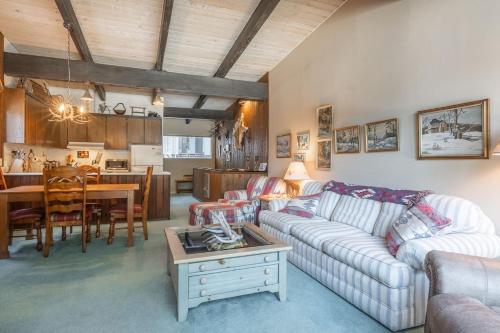 a living room with a couch and a table at Pet Friendly 2B2B on Lake Basins Bike Path! in Mammoth Lakes