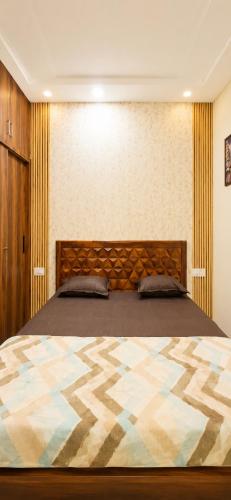 a bedroom with a large bed in a room at The Elite Luxury Suite in Dehradun