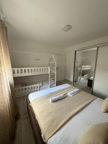 a bedroom with a large bed with two pillows on it at Nikola,Villa Vuletic in Neum
