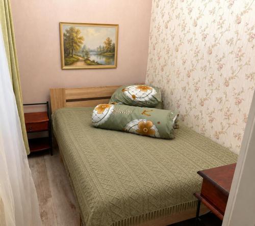 a small bedroom with a bed with a teddy bear pillow at The Loka in Riga