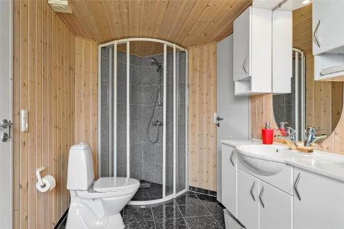 a bathroom with a white toilet and a shower at 30101-Malling-Noddevaenget-5-A in Malling