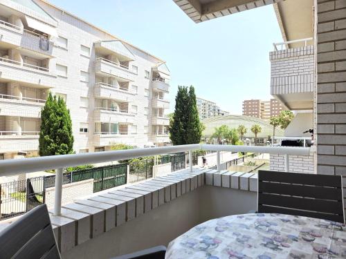 a balcony with a table and a view of a building at Apartamento Trebol 2 in Oropesa del Mar