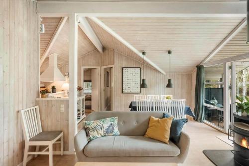 a living room with a couch and a kitchen at M396-Vaeggerlose-Torilisvej-3 in Bøtø By