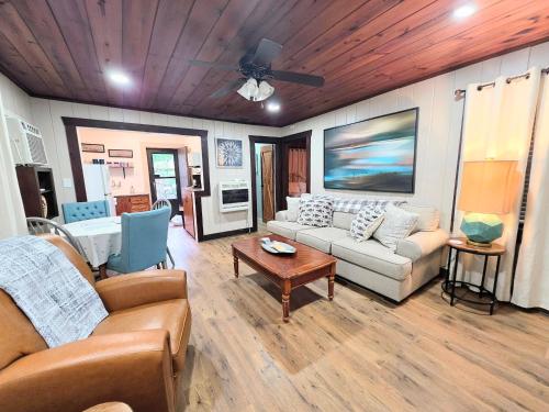 a living room with a couch and a table at #09 - Large Lakeview One Bedroom- Pet Friendly in Hot Springs