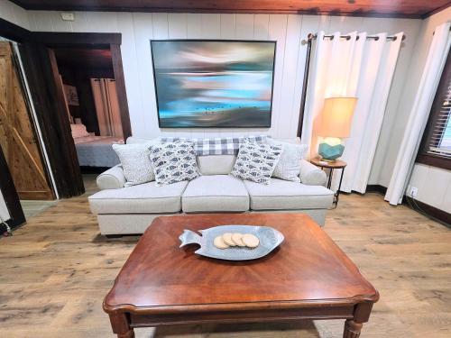 a living room with a couch and a coffee table at #09 - Large Lakeview One Bedroom- Pet Friendly in Hot Springs