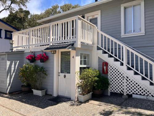 a house with a white porch and stairs at Briarwood Inn in Carmel