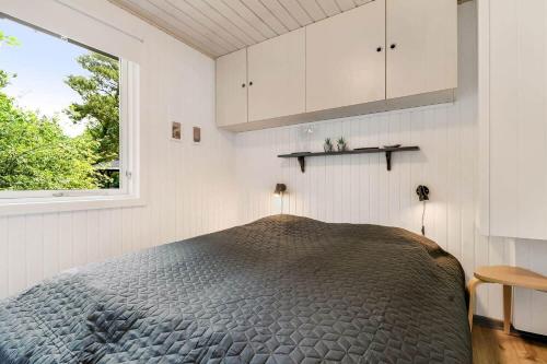 a bedroom with a bed and a window at C11252-hemmet-Anevej-7 in Hemmet