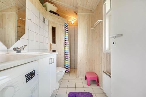a bathroom with a toilet and a sink and a pink stool at 30098-Malling-Norsmindevej-171-K in Malling