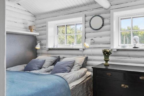 a bedroom with a bed and a mirror and windows at 30192-Malling-Askvaenget-13 in Malling