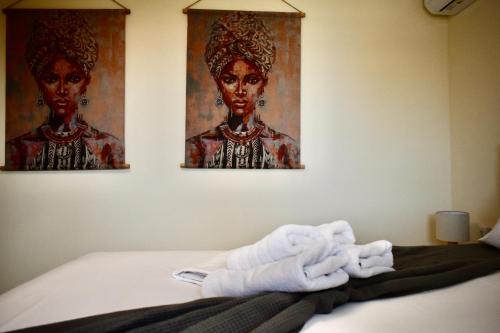 a room with a bed with a pile of towels at Calliroe Sea View in Alexandroupoli