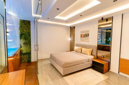a bedroom with a bed and a glass wall at Liveable artwork in Sousse