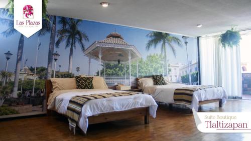 a room with two beds and a mural of a resort at Suites Las Plazas in Cuernavaca