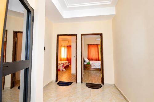 a room with a view of a bedroom at Résidence APOW in Agogoudjou