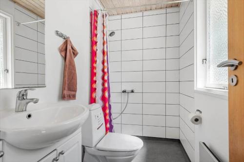 a bathroom with a toilet and a sink at 30061-Malling-Morbaervaenget-18 in Malling