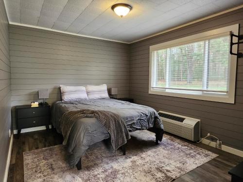 a bedroom with a bed and a window at TeePee Room 17- Full Kitchen in Roscommon