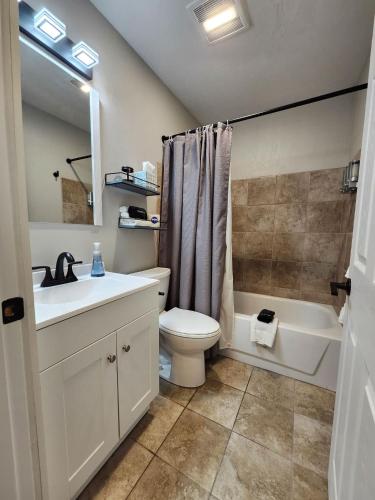 a bathroom with a sink and a toilet and a bath tub at TeePee Room 17- Full Kitchen in Roscommon