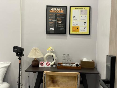 a room with a table with a sign on the wall at Soulstay Bangkok in Bangkok