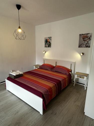 a bedroom with a large bed in a white room at Modern & Comfortable Apartment in Tenerife South in Guargacho