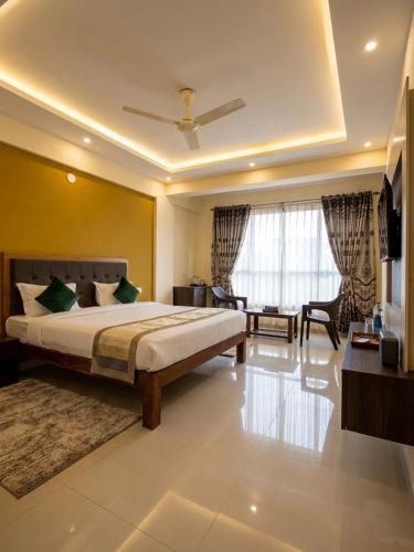 a bedroom with a large bed in a room at Morjim Pride Hotel with Swimming Pool near Morjim Beach in Morjim