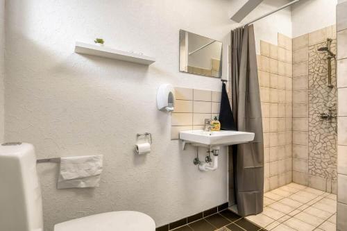 a bathroom with a toilet and a sink at C11694-Hemmet-Klydevaenget-1 in Hemmet