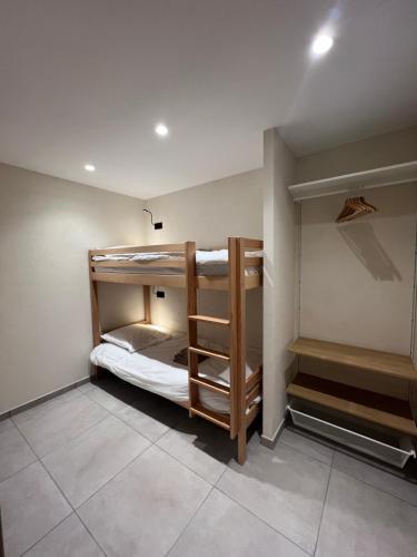 a room with two bunk beds in it at Les Loges de Sainte Anne in Saint-Michel-de-Maurienne