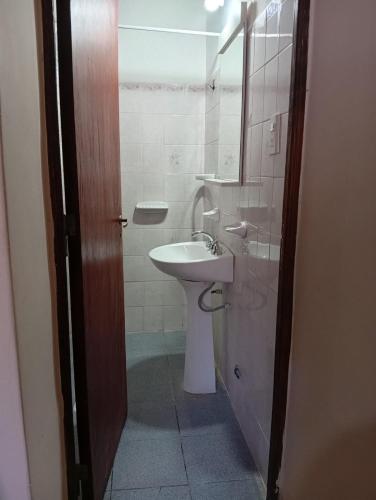 a bathroom with a sink and a toilet at HOSPEDAJE LA CASONA DE CACHI in Cachí