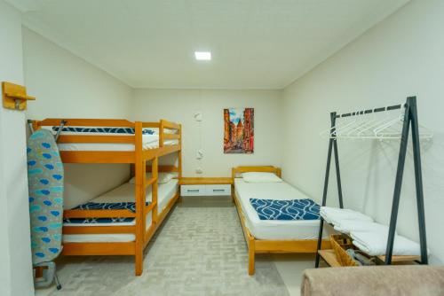 a room with a bunk bed and two bunk beds at HENNA VILLA in Fethiye