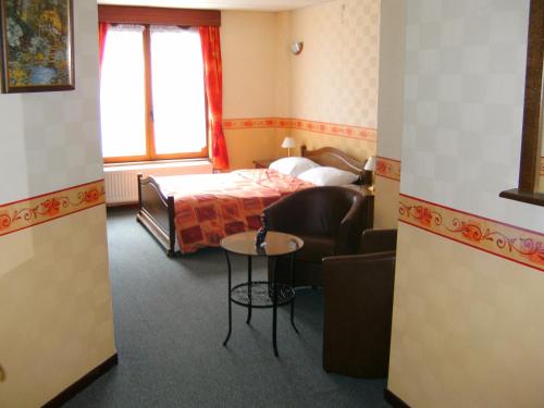 Postel nebo postele na pokoji v ubytování B&B Le Petit Normand