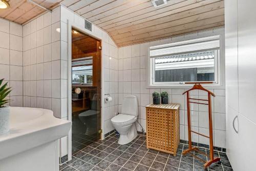 a bathroom with a toilet and a sink at C11266-Hemmet-Egernvej-10 in Hemmet