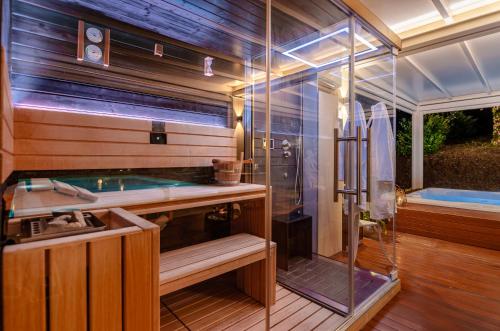 a large bathroom with a tub and a shower at Villa Ca' Viola Rimini in Rimini