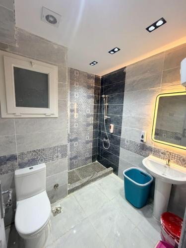 a bathroom with a toilet and a sink and a shower at Coronado Marina in Ain Sokhna