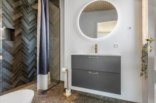 a bathroom with a sink and a mirror at 30433-Saksild-Strand-Odder-Strandlodden-2 in Rude