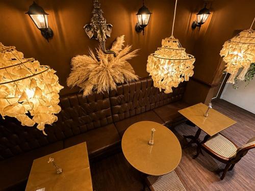 an overhead view of a restaurant with tables and chandeliers at Vivaz Boutique Hotel in Recife