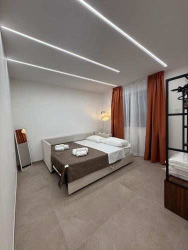 a bedroom with a large bed in a room at Villa Heaven Sperlonga in Itri
