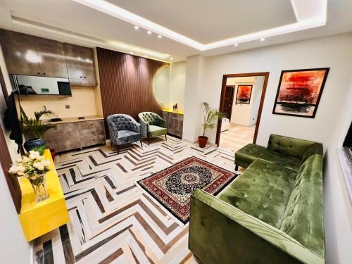 a living room with a couch and a table at Jinnah Mall Main Boulevard Jubilee Town in Lahore
