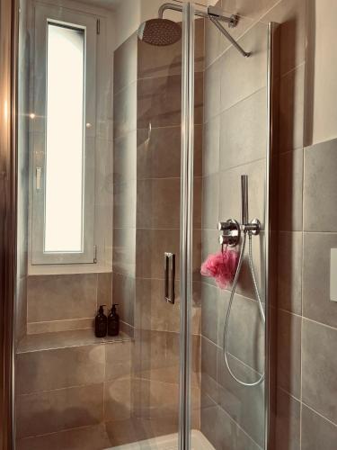 a shower with a glass door in a bathroom at 5 min from the center, Elevator , 4 guests, 2 bedrooms in Turin