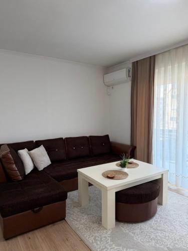 a living room with a couch and a coffee table at Mimi's Place in Gradačac