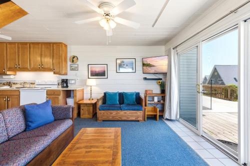 a living room with a couch and a table at Chalet #20 in Stevensville
