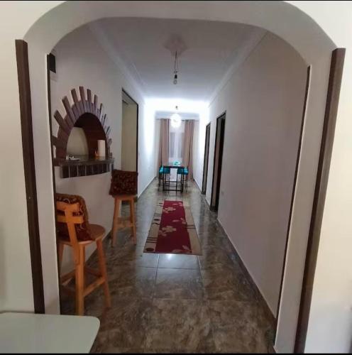 a hallway with a living room and a dining room at فيلا تسنيم للعائلات in Naj‘ al Aḩwāl