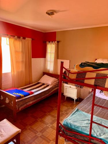 a room with two bunk beds and a window at Quintacolastinenorte in Santa Fe