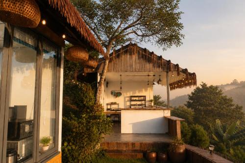a view of a house from the outside of a window at THỎ NON GARDEN CLOUDY OCEAN VIEW in Blao Srê