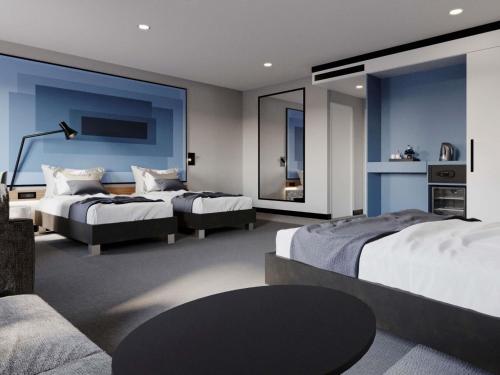 a hotel room with two beds and a couch at IBIS LAGOS LEKKI in Lagos