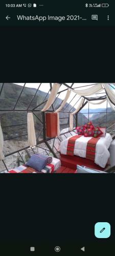a picture of a tent with a bed in it at Hotel cápsulas Mayta Capac in Sahuayacu