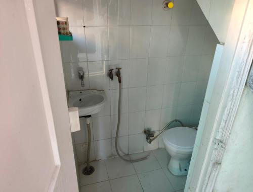 a bathroom with a toilet and a sink at Subhash Chander homestay in Panchkula