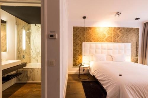 Postel nebo postele na pokoji v ubytování Hotel Rubens-Grote Markt