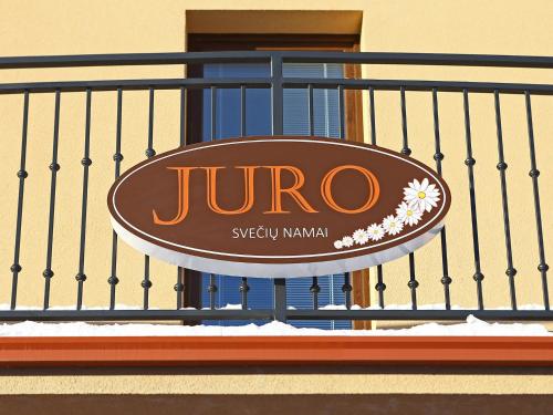 a sign that is on the side of a building at Juro Guest House in Šiauliai