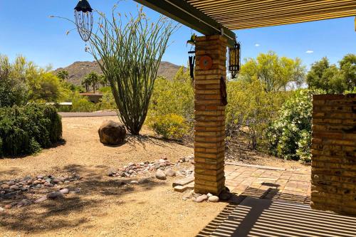 a brick pillar in a yard with a fire place at Tranquil Trail #6 in Carefree