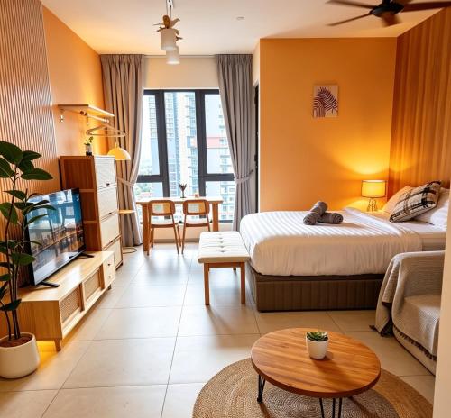 a hotel room with two beds and a table at Central Georgetown Studio with Nespresso Machine in George Town